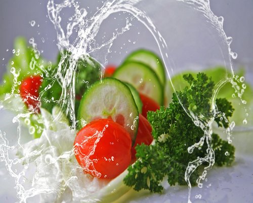 Healthy balanced meal with vegetables and fresh water